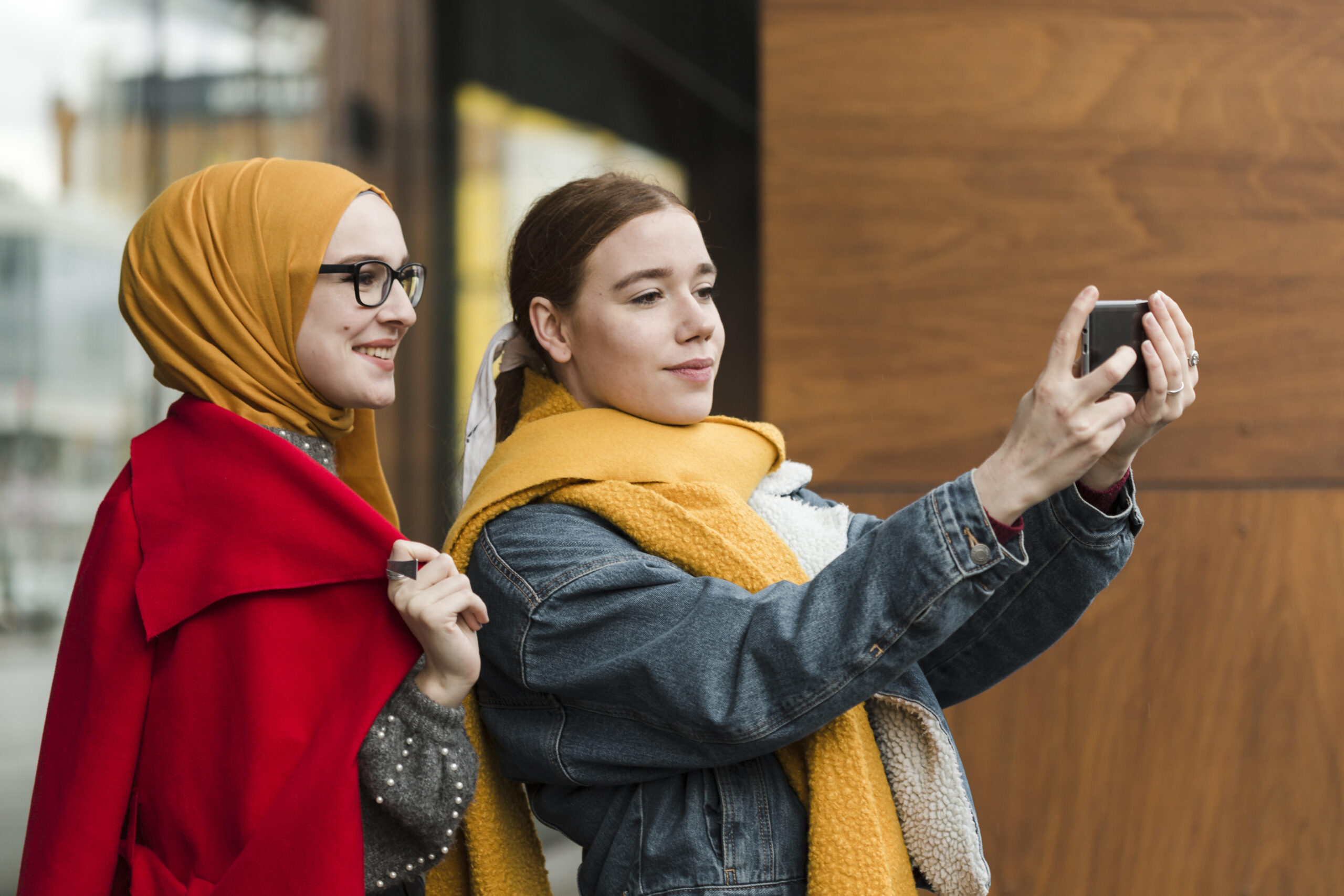 A vibrant digital collage showing young Turkish influencers creating content on TikTok, Instagram, and YouTube, blending traditional Turkish patterns with modern visuals and music, representing the Türk Idla cultural movement.